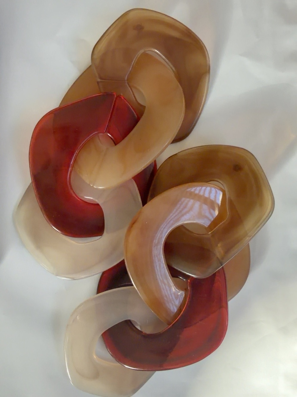 Decorative Linked Resin Wall Sculpture in Amber, Red, and Cream - Unbranded